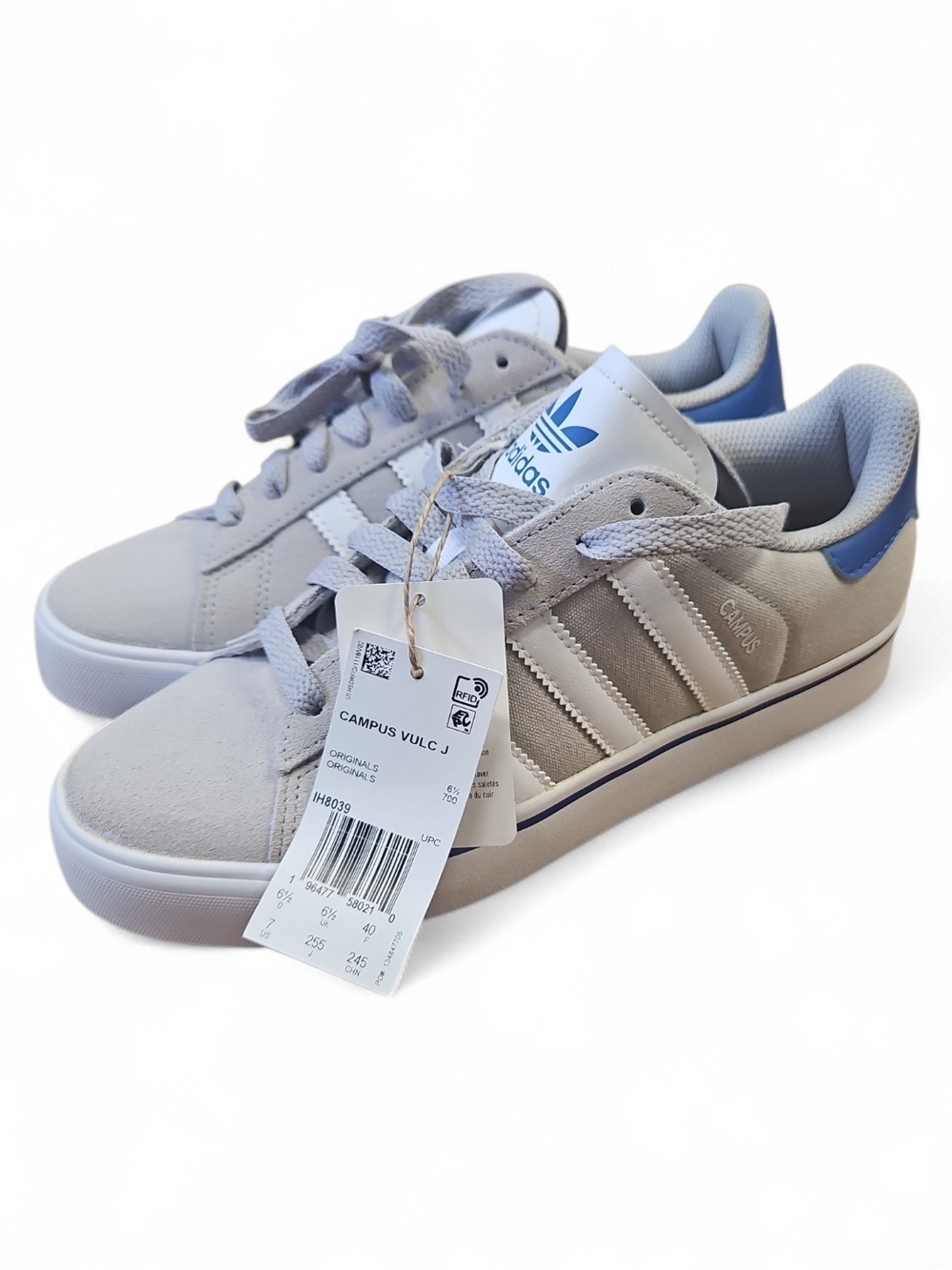Adidas Campus Vulc J sneakers in a grey colorway with blue accents.